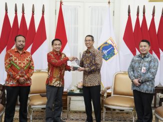 Anggota Ombudsman RI, Hery Susanto menyampaikan Hasil Penilaian Kepatuhan Standar Pelayanan Publik Provinsi DKI Jakarta di Balai Kota Jakarta, Kamis (29/12/2022).
